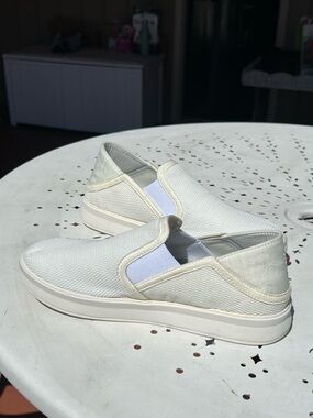 OluKai Slip-On Sneakers in White/Cream